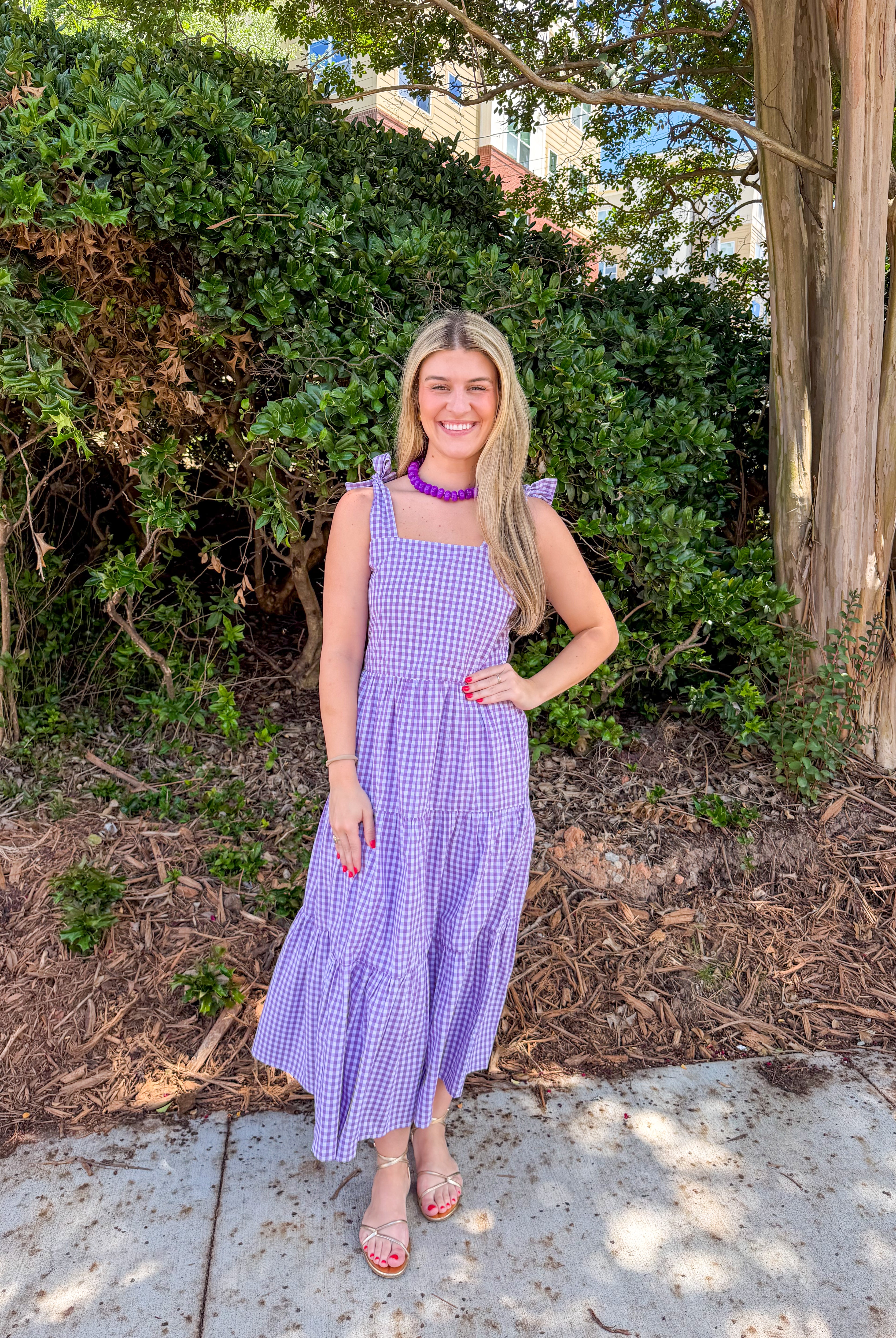 orange and purple dress ROCHELLE ONE SHOULDER SLEEVELESS ADJUSTABLE SIDE CUT OUT ASYMMETRIC PLEATED MAXI It includes a round neckline and an adjustable waist with tassel ties for a fun DRESSES True Orange Boutique